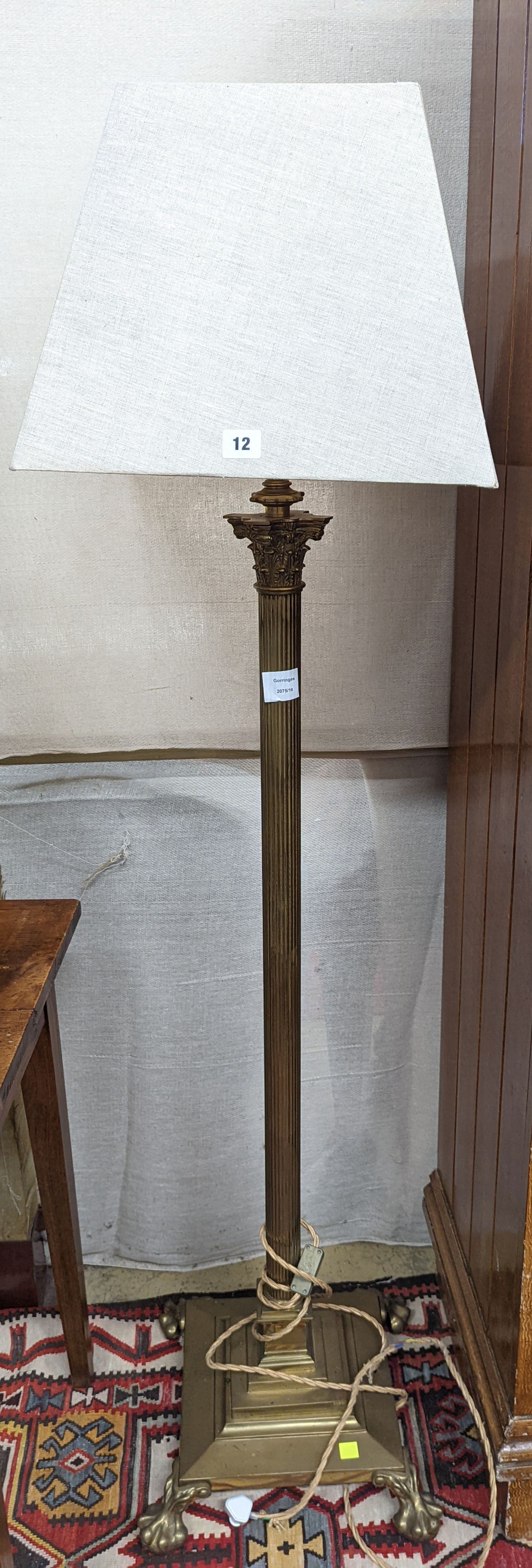 An early 20th century brass Corinthian column standard lamp